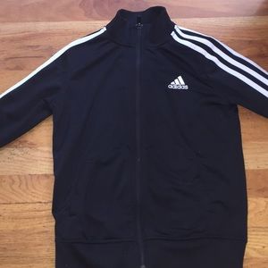 A black striped Adidas zip up